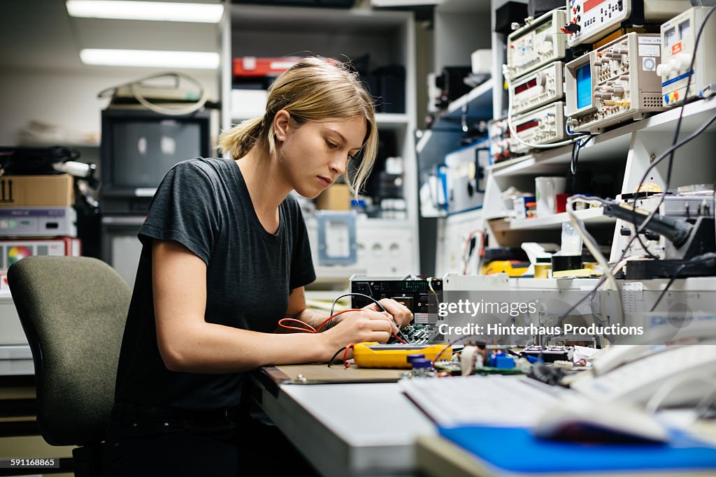 Female Engineer Measuring Voltage