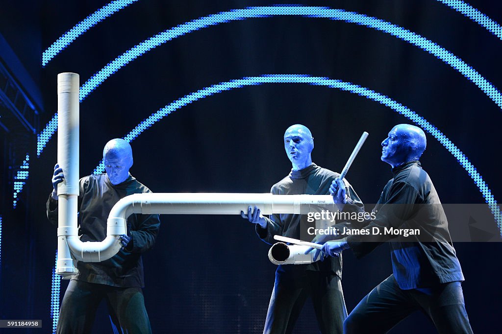 Blue Man Group Performing Live on stage with large PVC Pipe on 14th