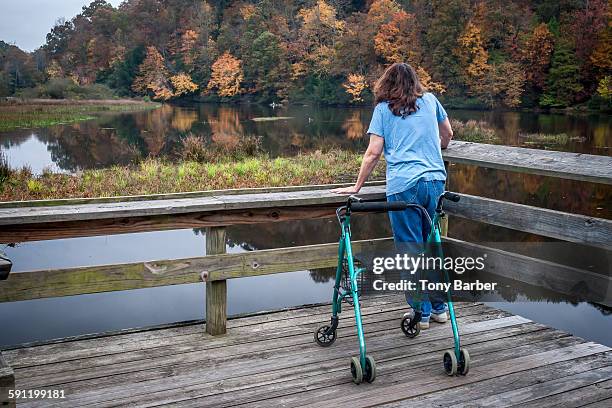 handicapped lady on a fock - multiple sclerose stockfoto's en -beelden