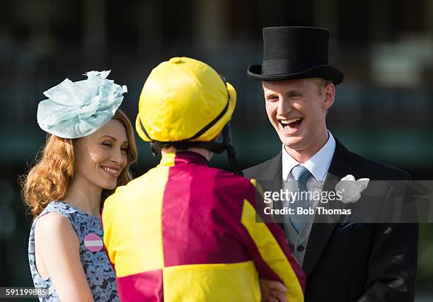 jockey and owners in parade ring - top hat stock pictures, royalty-free photos & images