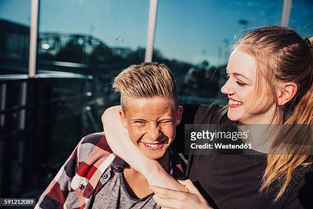two playful teenagers outdoors - headlock stock pictures, royalty-free photos & images