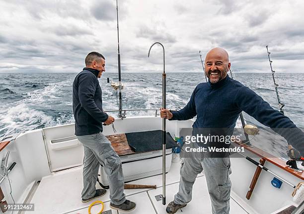 spain, asturias, fishermen on fishing boat on cantabrian sea - deep sea fishing stock-fotos und bilder