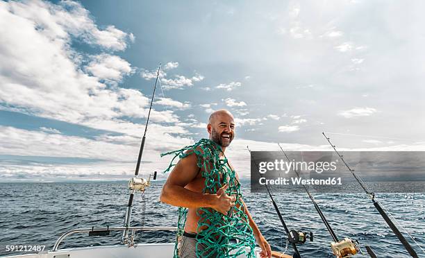 spain, asturias, fisherman on fishing boat on cantabrian sea - deep sea fishing stock-fotos und bilder