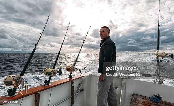 spain, asturias, fisherman on fishing boat on cantabrian sea - deep sea fishing stock pictures, royalty-free photos & images