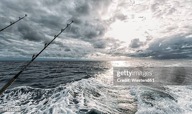 spain, asturias, fishing rods on fishing boat - deep sea fishing stock-fotos und bilder