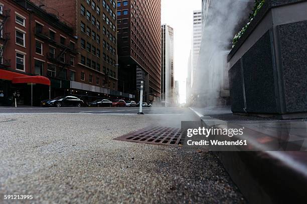 usa, new york city, downtown manhattan, haze coming out of a gully in the morning - kerb stock pictures, royalty-free photos & images