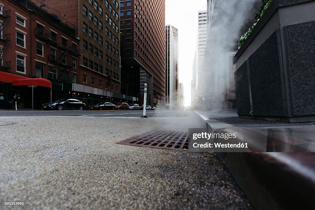 USA, New York City, Downtown Manhattan, haze coming out of a gully in the morning