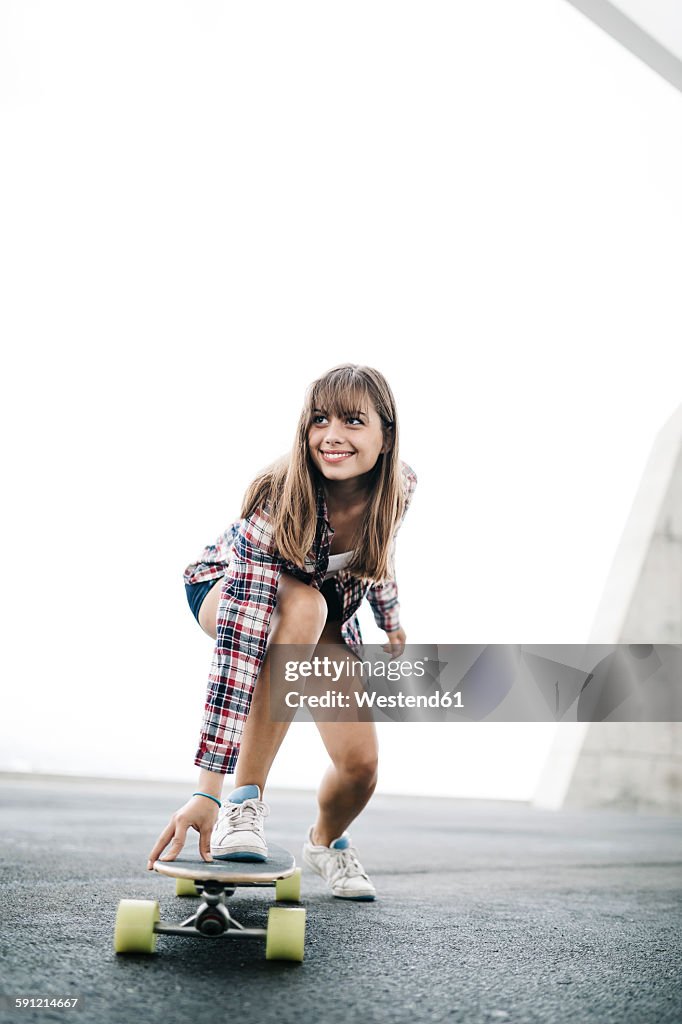 Young woman on longboard