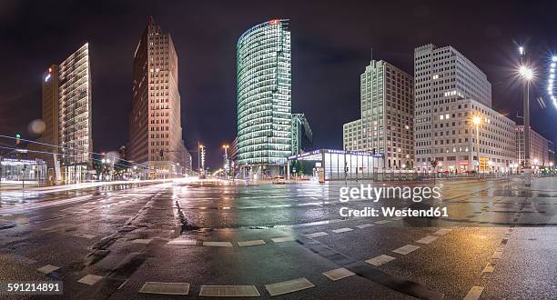 germany, berlin, panoramic view of potsdamer platz during a rainy night - postdamer platz stock pictures, royalty-free photos & images