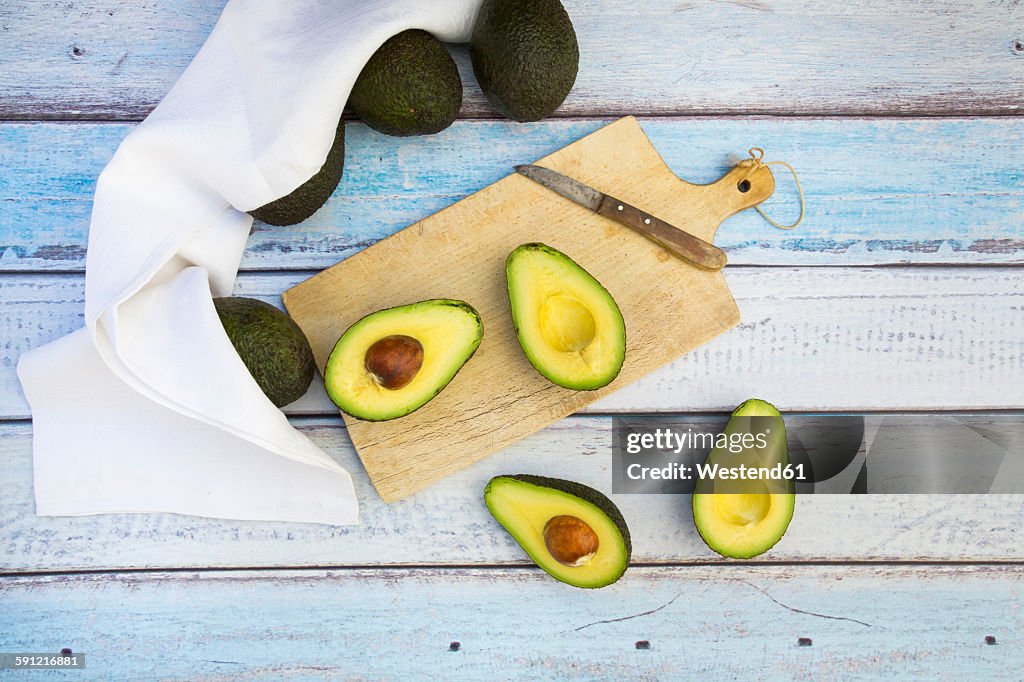 Whole and sliced avocado
