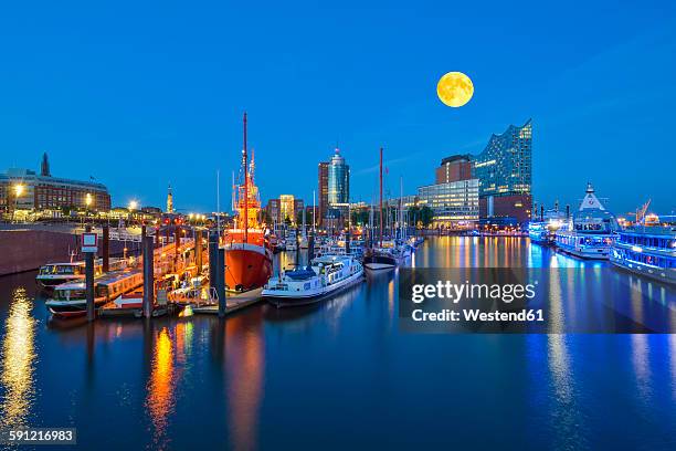 germany, harbour at full moon, elbphilharmonie and hanseatic trade center in background - elbphilharmonie fotografías e imágenes de stock