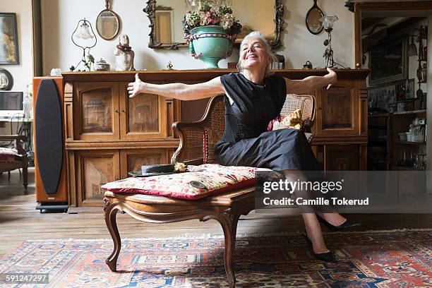 excited fashionable senior woman - personal wealth stock pictures, royalty-free photos & images