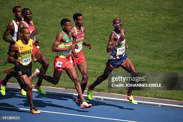 Jamaica's Kemoy Campbell, Ethiopia's Hagos Gebrhiwet, Eritrea's Goitom Kifle and Britain's Mo Farah compete in the Men's 5000m Round 1 during the...