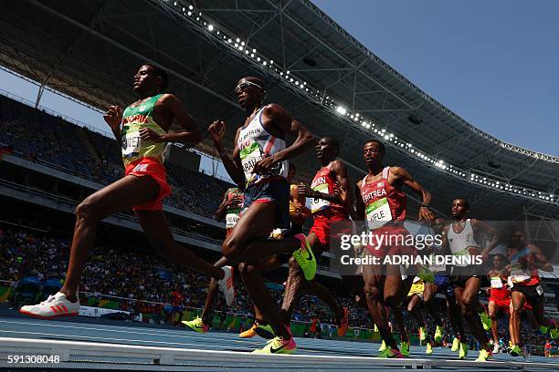 Ethiopia's Hagos Gebrhiwet, Britain's Mo Farah, Eritrea's Goitom Kifle, Belgium's Bashir Abdi and Azerbaijan's Hayle Ibrahimov compete in the Men's...