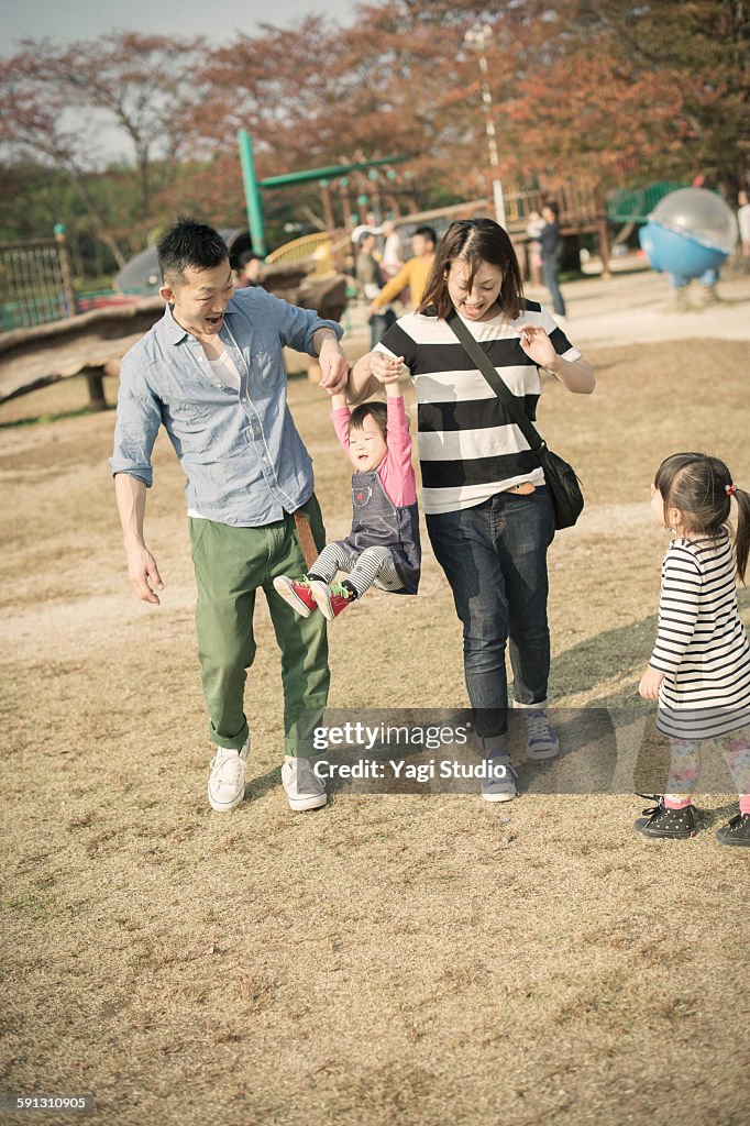 Family playing in the park