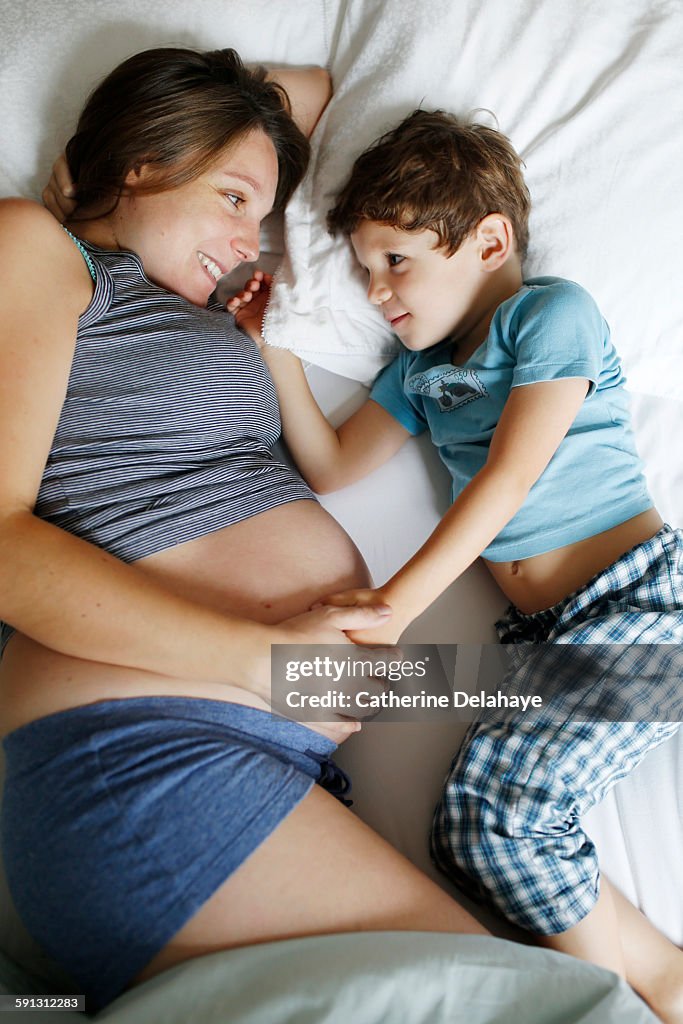 A pregnant woman with her 4 years old son