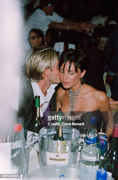 English footballer David Beckham and his wife, singer Victoria Beckham of the Spice Girls, during the MOBO Awards at the Royal Albert Hall in London,...
