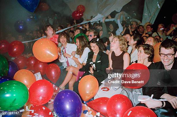 English jewelry designer Jade Jagger with her mother Bianca Jagger and fashion designer Daniel Macmillan at a Julien MacDonald fashion show at the...