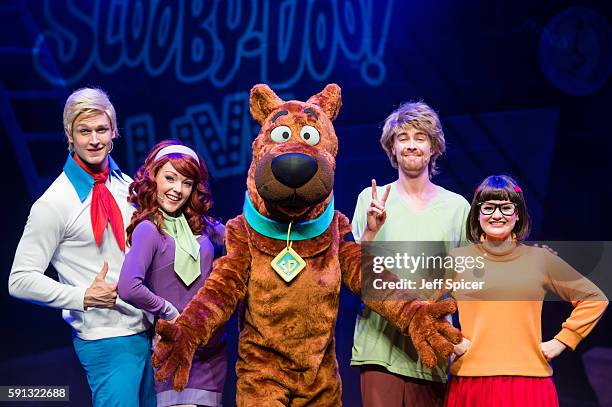 Chris Warner Drake as Fred, Charlie Bull as Daphne, Joe Goldie as Scooby-Doo, Charlie Haskins as Shaggy and Rebecca Withers as Velma appear on stage...