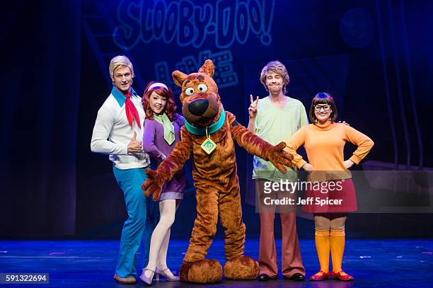 Chris Warner Drake as Fred, Charlie Bull as Daphne, Joe Goldie as Scooby-Doo, Charlie Haskins as Shaggy and Rebecca Withers as Velma appear on stage...