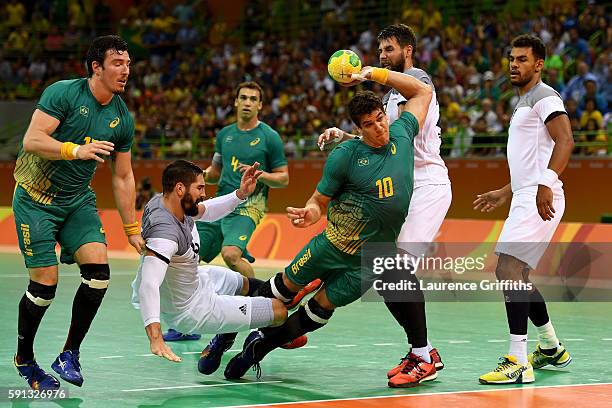 Jose Guilherme de Toledo of Brazil takes a shot during the Men's Quarterfinal Handball contest at Future Arena on Day 12 of the Rio 2016 Olympic...