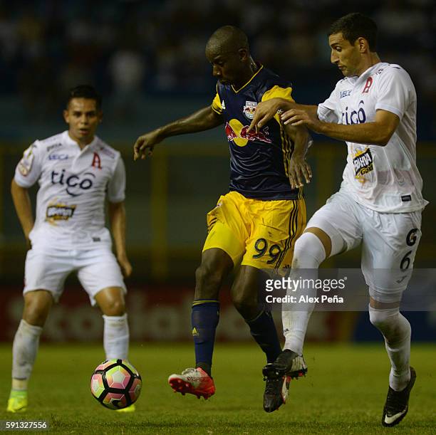 Bradley Wright-Phillips of Red Bulls fights for the ball with Fabricio Silva of Alianza during a match between Red Bulls and Alianza as part of Liga...