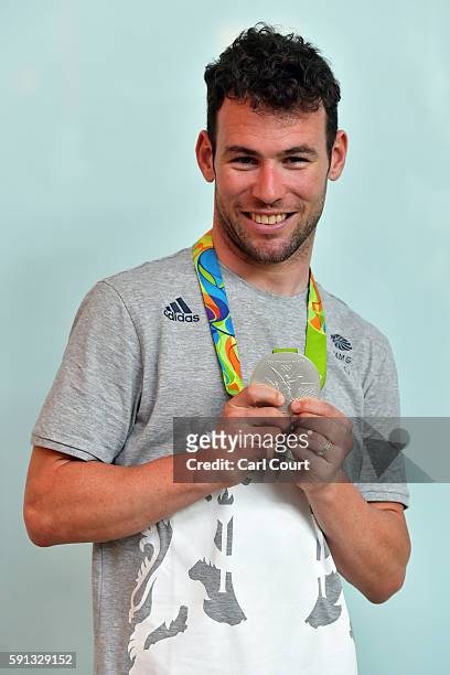 Great Britain's Mark Cavendish poses for a photograph with his silver medal after arriving on a British Airways flight from Rio de Janeiro to London...