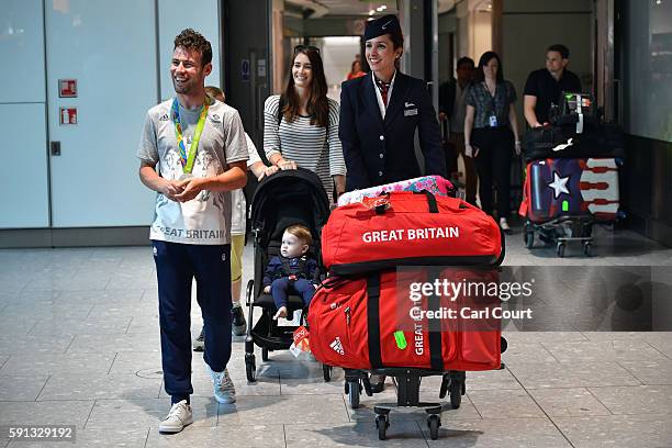 Great Britain's Mark Cavendish walks through the arrivals hall after arriving on a British Airways flight from Rio de Janeiro to London Heathrow...