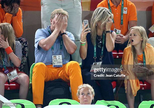 King Willem-Alexander of the Netherlands and Queen Maxima of the Netherlands react when Epke Zonderland of the Netherlands they came to support falls...