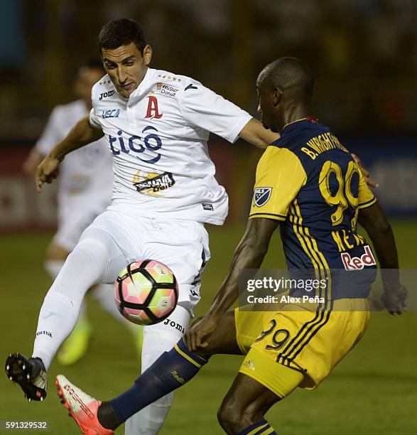 Bradley Wright-Phillips of Red Bulls fights for the ball with Fabricio Silva of Alianza during a match between Red Bulls and Alianza as part of Liga...