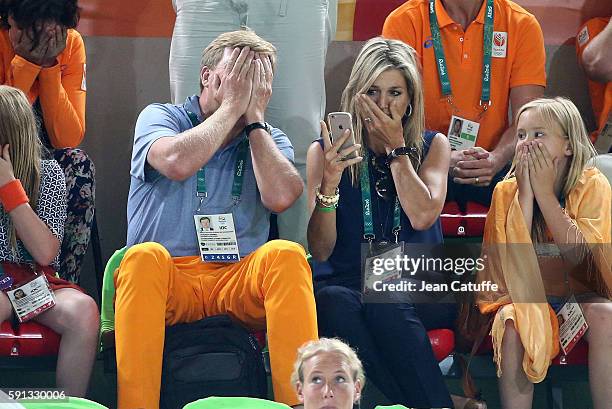 King Willem-Alexander of the Netherlands and Queen Maxima of the Netherlands react when Epke Zonderland of the Netherlands they came to support falls...