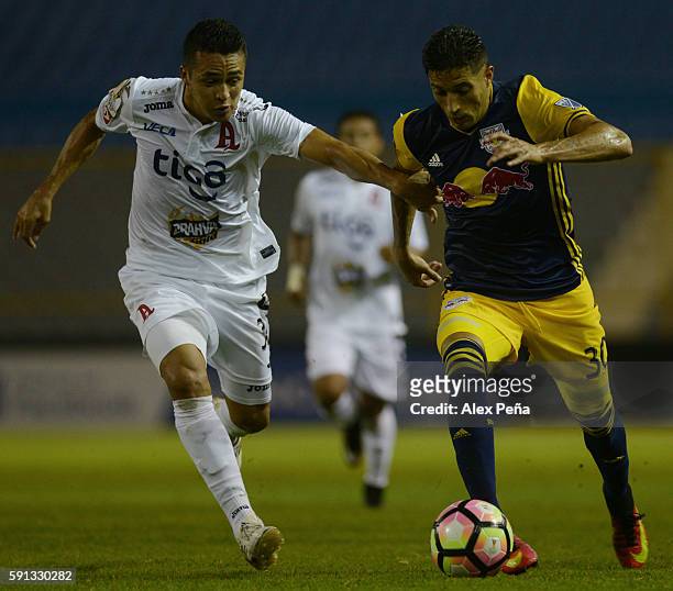 Gonzalo Veron of Red Bulls fights for the ball with Elmer Abarca of Alianza during a match between Red Bulls and Alianza as part of Liga de Campeones...