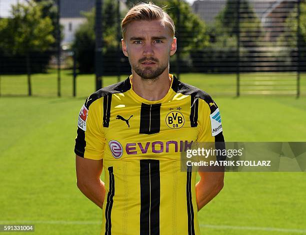 Dortmund's defender Marcel Schmelzer poses during the team presentation of Borussia Dortmund on August 17, 2016 in Dortmund, western Germany. / AFP /...