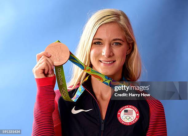 Emma Coburn of the United States poses for a photo with her bronze medal in the 3000 Meter Steeplechase on the Today show set on Copacabana Beach on...