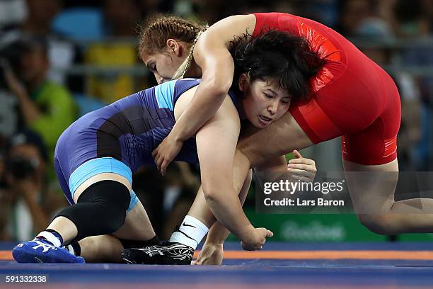 Sara Dosho of Japan competes against Buse Tosun of Turkey during a Women's Freestyle 69kg 1/8 Final bout on Day 12 of the Rio 2016 Olympic Games at...