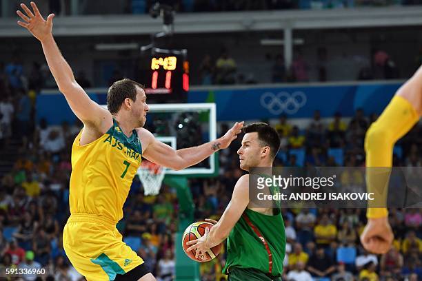 Australia's small forward Joe Ingles holds off Lithuania's guard Adas Juskevicius during a Men's quarterfinal basketball match between Australia and...