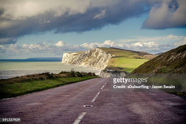 the road to freshwater bay - isle of wight stock pictures, royalty-free photos & images