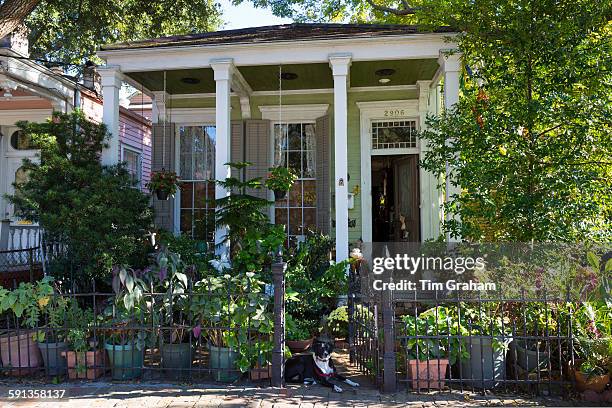 Traditional clapboard cottage house with columns in the Garden District of New Orleans, Louisiana, USA