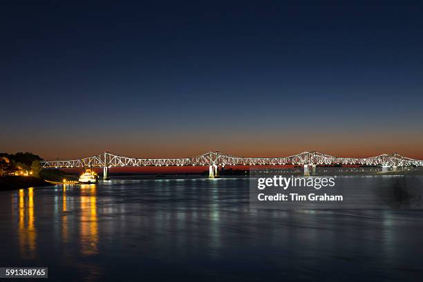 Nighttime scene of illuminated iron cantilever Natchez - Vidalia Bridge road bridge across the Mississippi River in Louisiana, USA