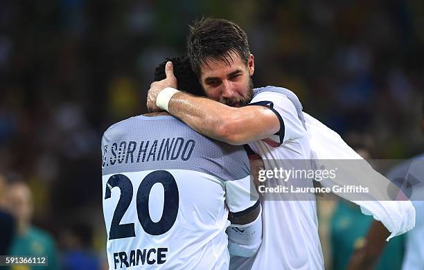 Cedric Sorhaindo and Nikola Karabatic of France celebrate their victory after the Men's Quarterfinal Handball contest against Brazil at Future Arena...