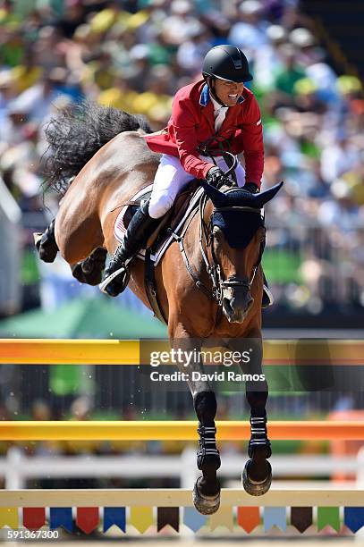 Kent Farrington of the United States rides Voyeur during the Jumping Team Round 2 during Day 12 of the Rio 2016 Olympic Games at the Olympic...