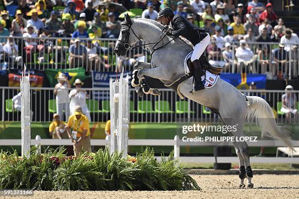 France's Philippe Rozier riding Rahotep de Toscane takes part in the jumping competition at the Olympic Equestrian Centre during the Rio 2016 Olympic...