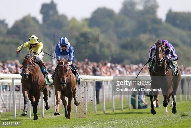 Andrea Atzeni riding Postponed win The Juddmonte International Stakes from Highland Reel and Mutakayyef at York racecourse on August 17, 2016 in...