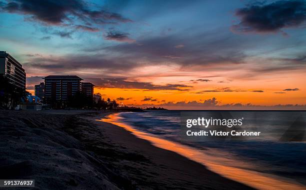 sunset at the condado beach, san juan de puerto ri - condado beach stock pictures, royalty-free photos & images