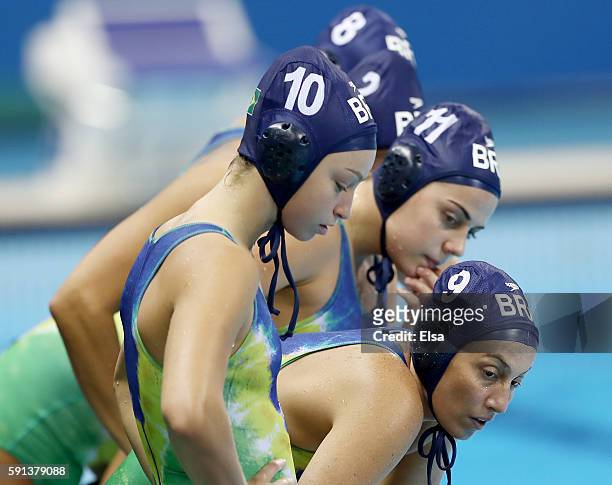 Viviane Bahia,Mariana Duarte and Camila Pedrosa of Brazil listen to coach Patrick Oaten in a time out against Australia during the Women's Water Polo...