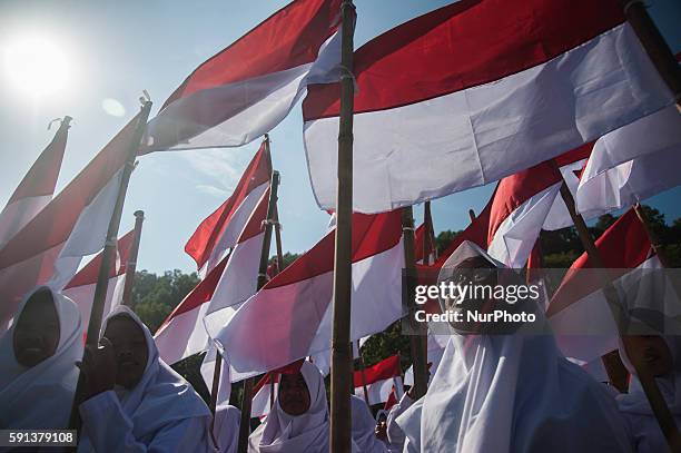 Indonesian people do ceremony in middle of the sea in beach Baron, Gunung Kidul, Yogyakarta, Indonesia, on August 17, 2016. About 350 Indonesian...