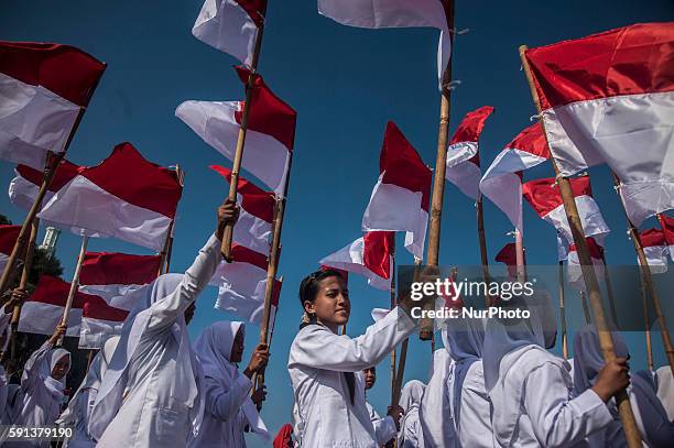 Indonesian people do ceremony in middle of the sea in beach Baron, Gunung Kidul, Yogyakarta, Indonesia, on August 17, 2016. About 350 Indonesian...