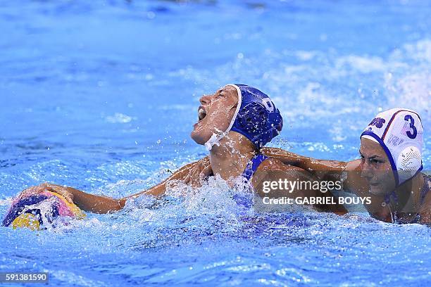 Italy's Rosaria Aiello vies with Russia's Ekaterina Prokofyeva during their Rio 2016 Olympic Games women's water polo semifinal game at the Olympic...