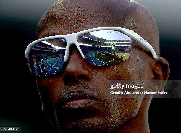 Mohamed Farah of Great Britain looks on prior to the Men's 5000m Round 1 on Day 12 of the Rio 2016 Olympic Games at the Olympic Stadium on August 17,...