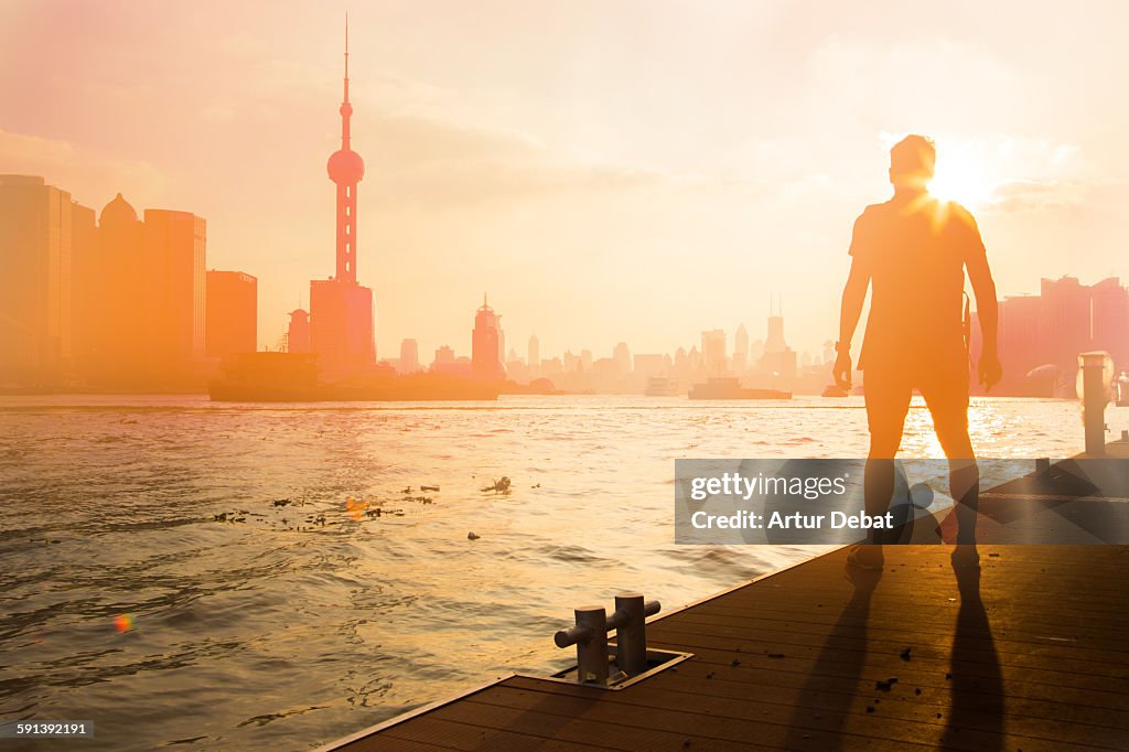 Man contemplating the Shanghai city sunset